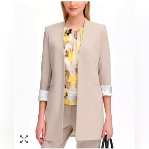 Calvin Klein's clever roll-tab blazer